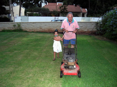Helping to mow the lawn