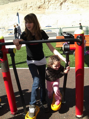 Amit on the exercise machine with Dani