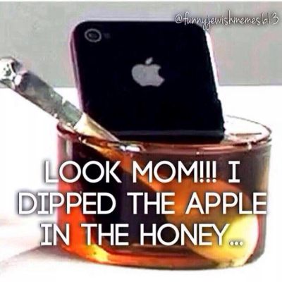 dipping apple in honey