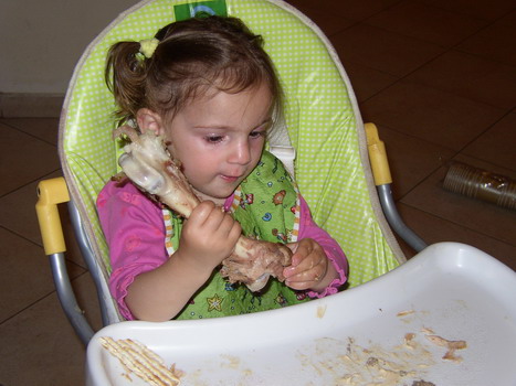 Amit eating a lamb bone at Pesach 2007
